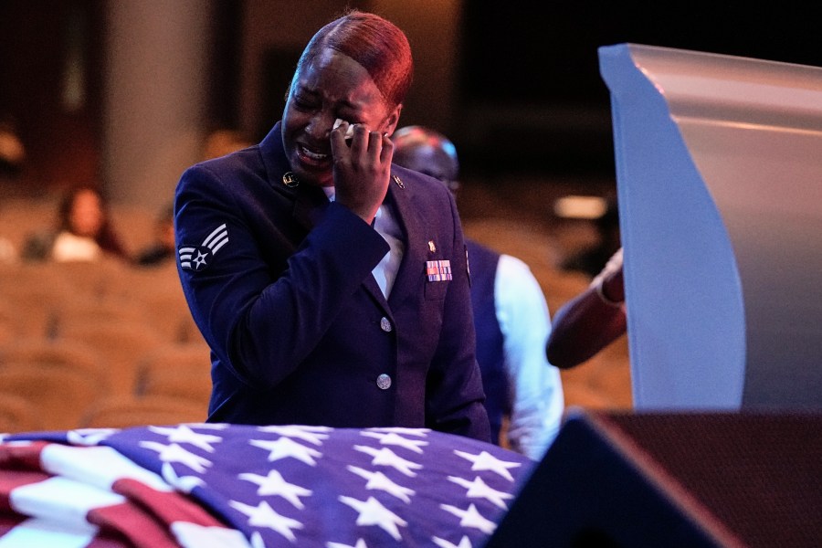 FILE - U.S. Air Force personnel stand near the coffin of slain airman Roger Fortson during his funeral at New Birth Missionary Baptist Church, Friday, May 17, 2024, near Atlanta. (AP Photo/Brynn Anderson, File)