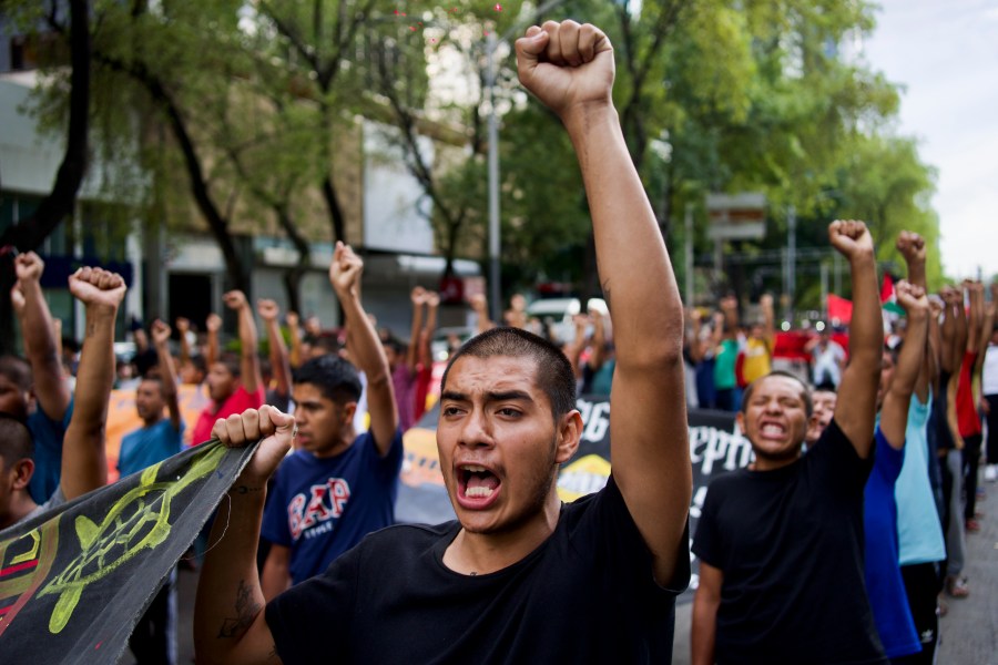 Classmates of the 43 Ayotzinapa students who went missing almost 10 years ago march to demand justice for their loved ones in Mexico City, Monday, Aug. 26, 2024. (AP Photo/Felix Marquez)