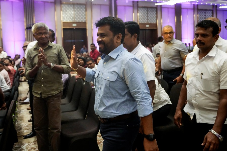 Anura Kumara Dissanayake, center, presidential candidate of opposition political party National People's Power arrives at the launching of his election manifesto in Colombo, Sri Lanka, Monday, Aug. 26, 2024. (AP Photo/Eranga Jayawardena)