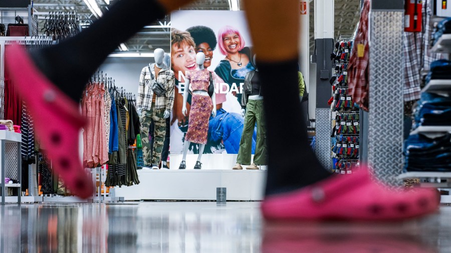 FILE - A customer walks by No Boundaries merchandise at a Walmart Superstore in Secaucus, New Jersey, July 11, 2024. (AP Photo/Eduardo Munoz Alvarez, File)