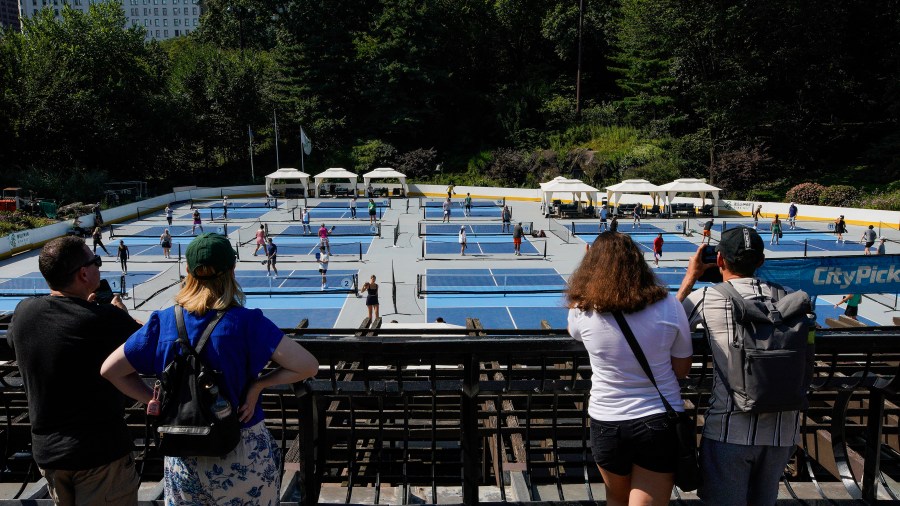 People practice pickleball on the courts of CityPickle at Central Park's Wollman Rink, Saturday, Aug. 24, 2024, in New York. (AP Photo/Eduardo Munoz Alvarez)