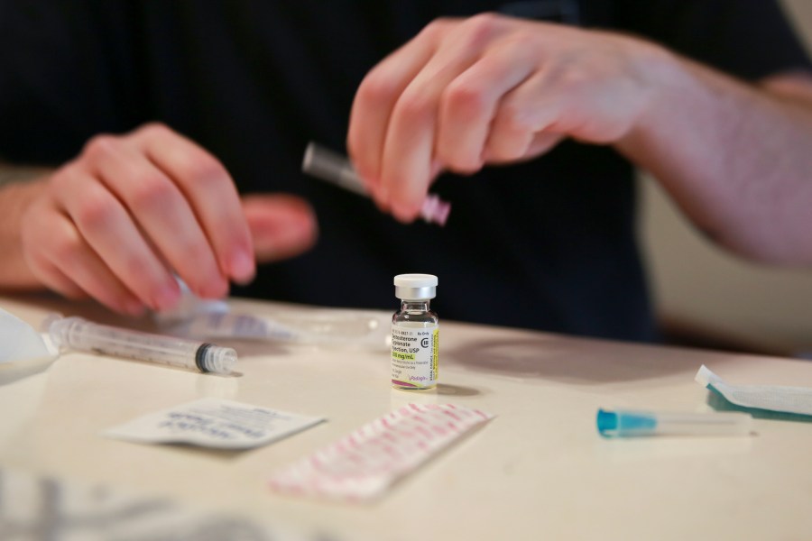 FILE - Lucas prepares his weekly testosterone shot at his home in Casselberry, Fla., May 29, 2023. The Associated Press is not using Lucas' last names because he fears reprisal. (AP Photo/Laura Bargfeld, File)