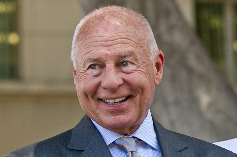 FILE - Attorney Tom Girardi smiles outside the Los Angeles courthouse, July 9, 2014. (AP Photo/Damian Dovarganes, File)