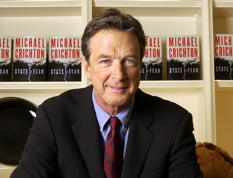 FILE - Author Michael Crichton poses for a portrait at The Peninsula Hotel in New York on Dec. 7, 2004. (AP Photo/Jim Cooper, File)