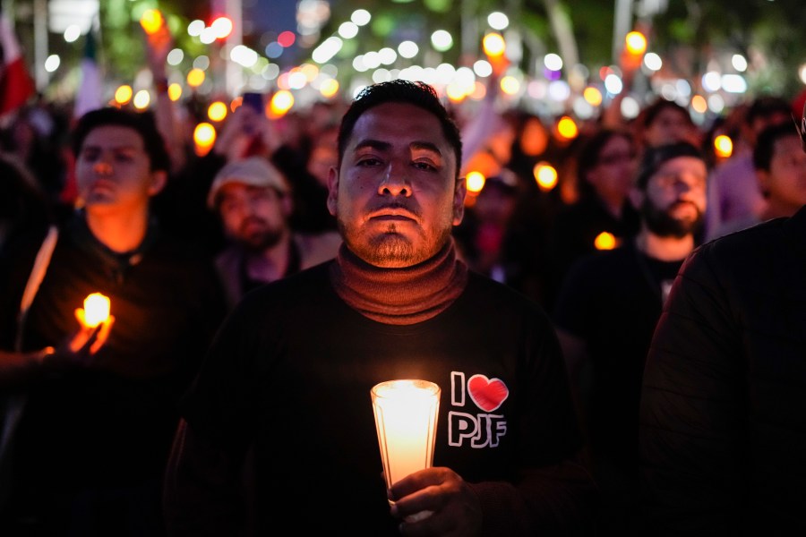 A unionized federal court worker protests against reforms that would make all judges stand for election in Mexico City, Monday, Aug. 26, 2024. (AP Photo/Eduardo Verdugo)