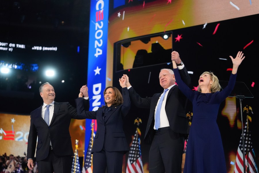 Democratic presidential nominee Vice President Kamala Harris with Second gentleman Douglas Emhoff and Democratic vice presidential candidate Minnesota Gov. Tim Walz with his wife Gwen Walz celebrate during the Democratic National Convention Thursday, Aug. 22, 2024, in Chicago. (AP Photo/Erin Hooley)