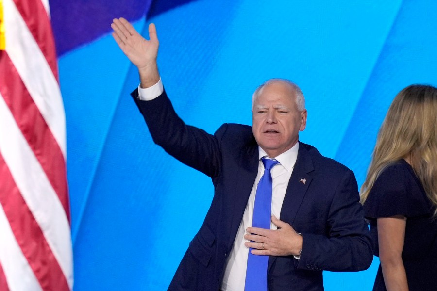 Democratic vice presidential nominee Minnesota Gov. Tim Walz, waves to the crowd after speaking during the Democratic National Convention Wednesday, Aug. 21, 2024, in Chicago. (AP Photo/J. Scott Applewhite)