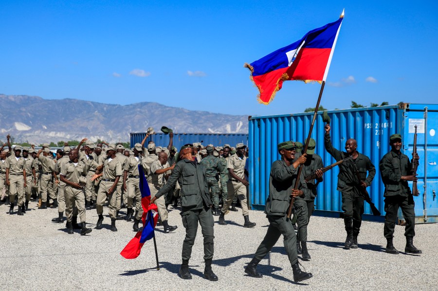 FILE - New members of the Armed Forces of Haiti celebrate after their graduation ceremony in Port-au-Prince, Haiti, Thursday, Dec. 22, 2022. (AP Photo/Odelyn Joseph, File)