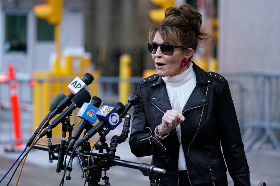 FILE - Former Alaska Gov. Sarah Palin speaks briefly to reporters as she leaves a courthouse in New York, Feb. 14, 2022. (AP Photo/Seth Wenig, File)