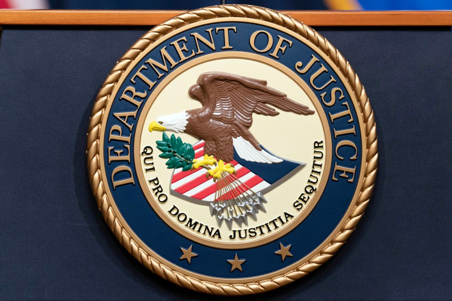 FILE - The Department of Justice seals is seen during a news conference at the DOJ office in Washington, May 16, 2023. (AP Photo/Jose Luis Magana, File)