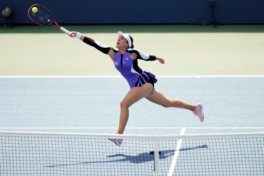 Elena-Gabriela Ruse, of Romania, returns a shot to Barbora Krejcikova, of the Czech Republic, during the first round of the U.S. Open tennis championships, Wednesday, Aug. 28, 2024, in New York. (AP Photo/Kirsty Wigglesworth)