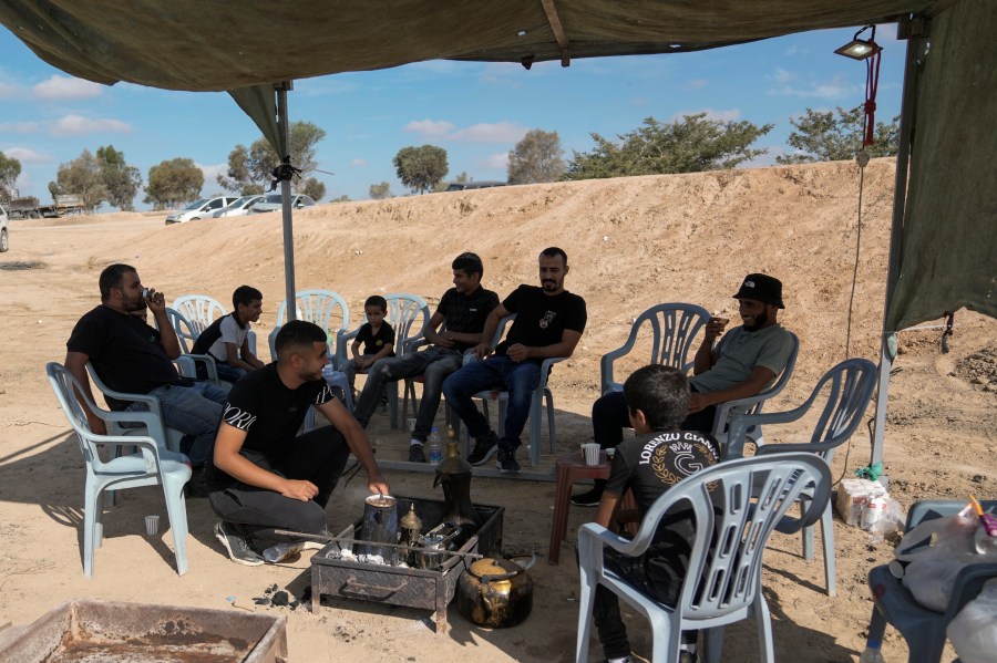 Relatives and friends of Qaid Farhan Alkadi, 52, who was held hostage by Hamas militants in Gaza Strip, wait for his arrival on an area in the Khirbet Karkur village, near Rahat, southern Israel, Wednesday, Aug. 28, 2024. (AP Photo/Mahmoud Illean)