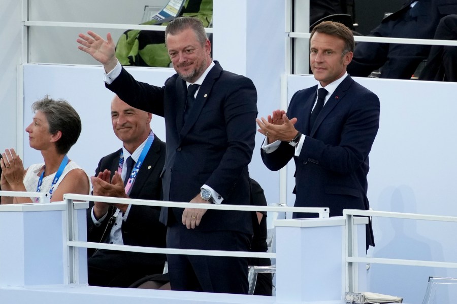 French President Emmanuel Macron, right, and IPC president Andrew Parson attend the Opening Ceremony for the 2024 Paralympics, Wednesday, Aug. 28, 2024, in Paris, France. (AP Photo/Emilio Morenatti)