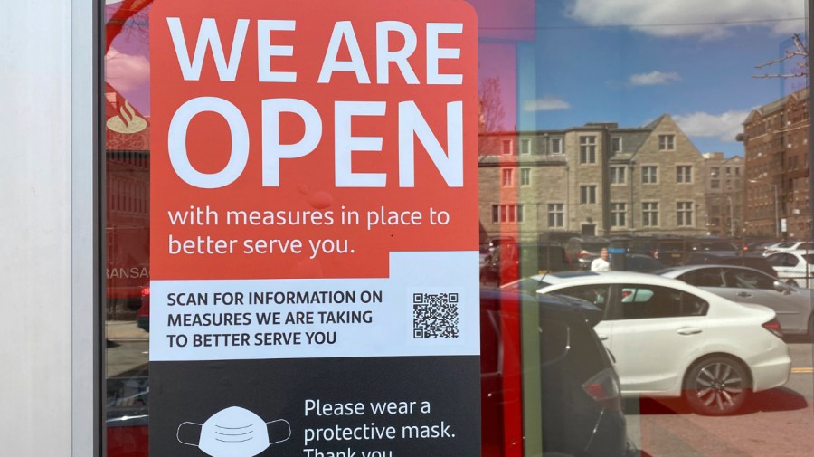 Santander Bank sign about Covid 19 safety and service, Queens, New York. (Photo by: Lindsey Nicholson/Education Images/Universal Images Group via Getty Images)