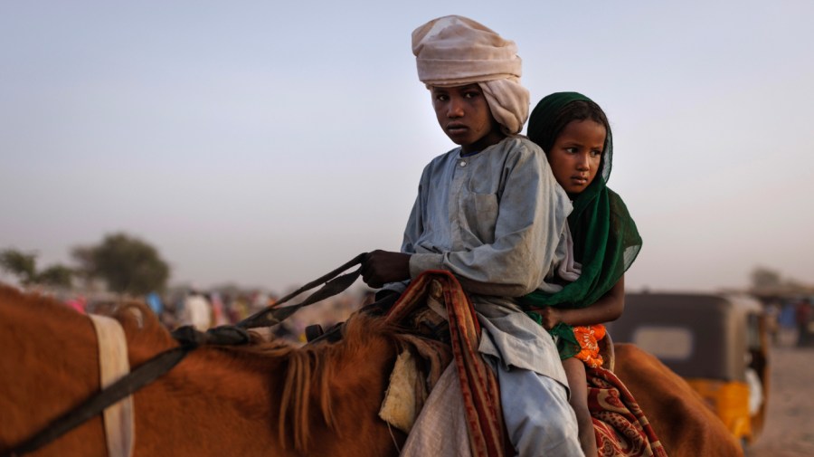 Newly arrived refugees from Darfur in Sudan, sit on horse as they head to their shelters on April 24, 2024 in Adre, Chad. Since the beginning of the recent conflict between the paramilitary Rapid Support Forces (RSF) and the the Sudanese Armed Forces, (SAF), which began in March 2023, over 600,000 new refugees have crossed the border from Darfur in Sudan, into Chad. The total number of refugees, including those from previous conflicts, now stands at 1.2 million. Aid agencies, including The World Food Programme, (WFP), Médecins Sans Frontières (MSF) and the United Nations High Commissioner for Refugees, (UNHCR), already struggling with acute supply shortages, have warned that the life-saving programmes in Chad, will ‘grind to a halt in a matter of weeks without urgent funding’. Chad is now home to one of the largest and fastest-growing refugee populations in Africa. (Photo by Dan Kitwood/Getty Images