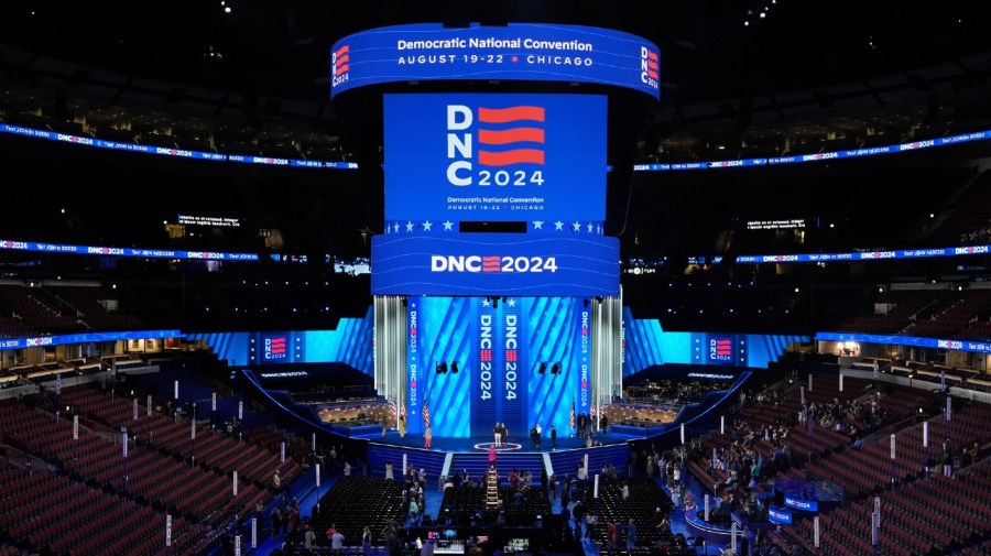 Workers prepare the convention floor at United Center before the Democratic National Convention Sunday, Aug. 18, 2024, in Chicago.