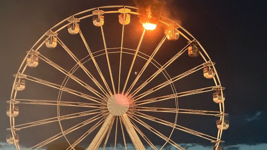 17 August 2024, Saxony, Großpösna: Flames can be seen on a Ferris wheel at the Highfield Festival. A fire has broken out on a Ferris wheel at the Highfield Festival on Lake Störmthal. Photo: Str./dpa (Photo by Str./picture alliance via Getty Images)