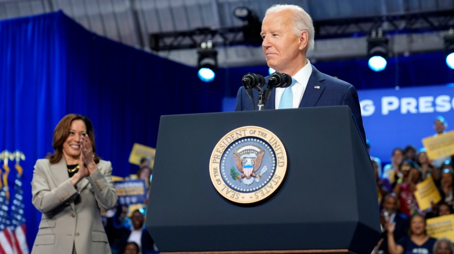 Democratic presidential nominee Vice President Kamala Harris listens as President Joe Biden speaks about the administration's efforts to lower costs during an event at Prince George's Community College in Largo, Md., Thursday, Aug. 15, 2024. (AP Photo/Susan Walsh)