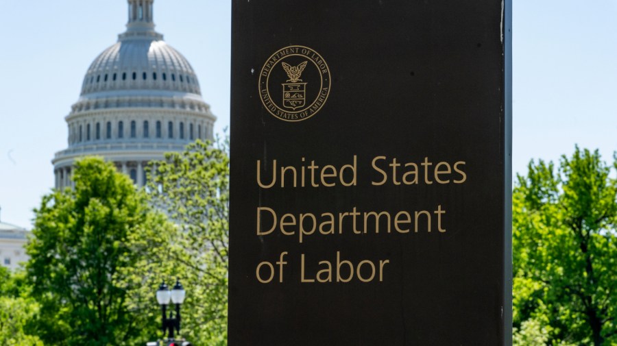 In this May 7, 2020, photo, the entrance to the Labor Department is seen near the Capitol in Washington. The record unemployment rate reflects a nation ravaged by the coronavirus pandemic, the economic devastation upending the presidential campaign and forcing President Donald Trump to overcome historic headwinds to win a second term. (AP Photo/J. Scott Applewhite)