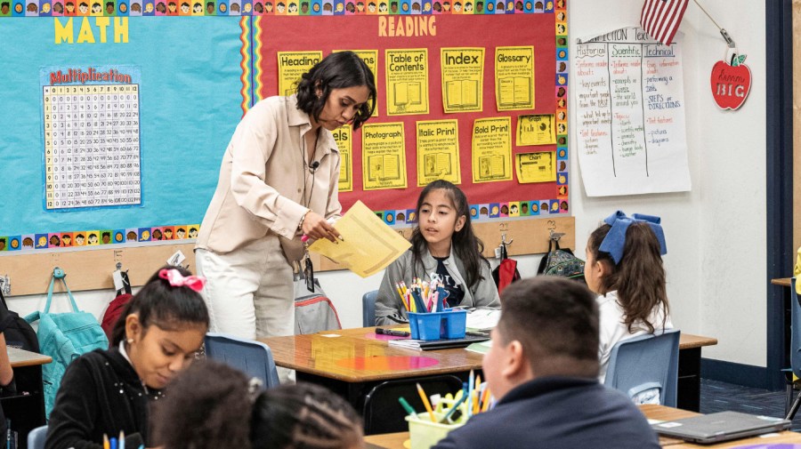 Teacher Alexxa Martinez works in her classroom in Nevitt Elementary School, in Phoenix, Arizona, on October 26, 2022. - Teachers in Arizona are among the United States' lowest paid, making the cost-of-living crisis even more acute for educators in this key battleground for the upcoming mid-term elections. (Photo by Olivier TOURON / AFP) (Photo by OLIVIER TOURON/AFP via Getty Images)