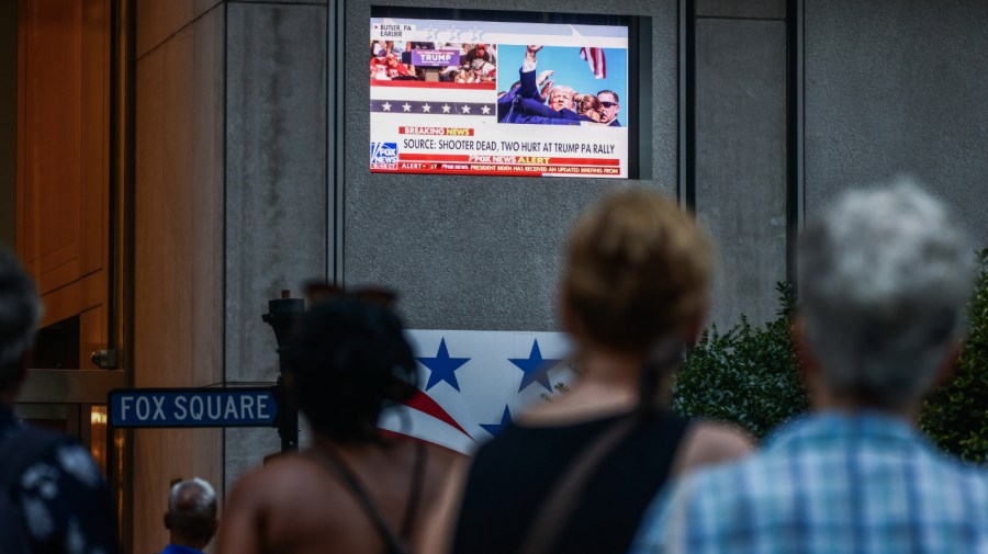 People watch Fox News channel in front of Fox News building in Manhattan after the former U.S. President Donald Trump has been injured during shooting at campaign rally at the Butler Farm Show in Butler, Pennsylvania. New York, United States of America on July 13th, 2024. The suspected shooter was killed and another rally attendee was dead. (Photo by Beata Zawrzel/NurPhoto via Getty Images)