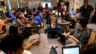 Westwood High School English teacher Jeff Hall, top center, monitors his class on Oct. 18, 2022 in Mesa, Ariz. Like many school districts across the country, Mesa has a teacher shortage due in part due to low morale and declining interest in the profession.